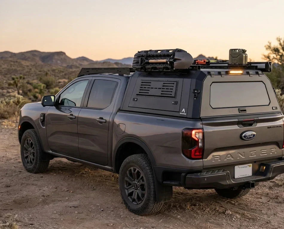 A Ford Ranger pickup truck equipped with a custom rear canopy