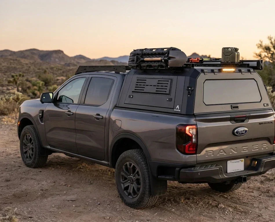 A Ford Ranger pickup truck equipped with a custom rear canopy