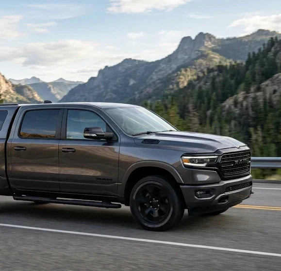 Sleek ram 1500 truck canopy 2025 2026 installed on a modern pickup truck parked offroad