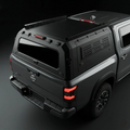 Nissan Titan 6.5ft Armacap steel truck canopy - 3/4 front view with gullwing doors closed